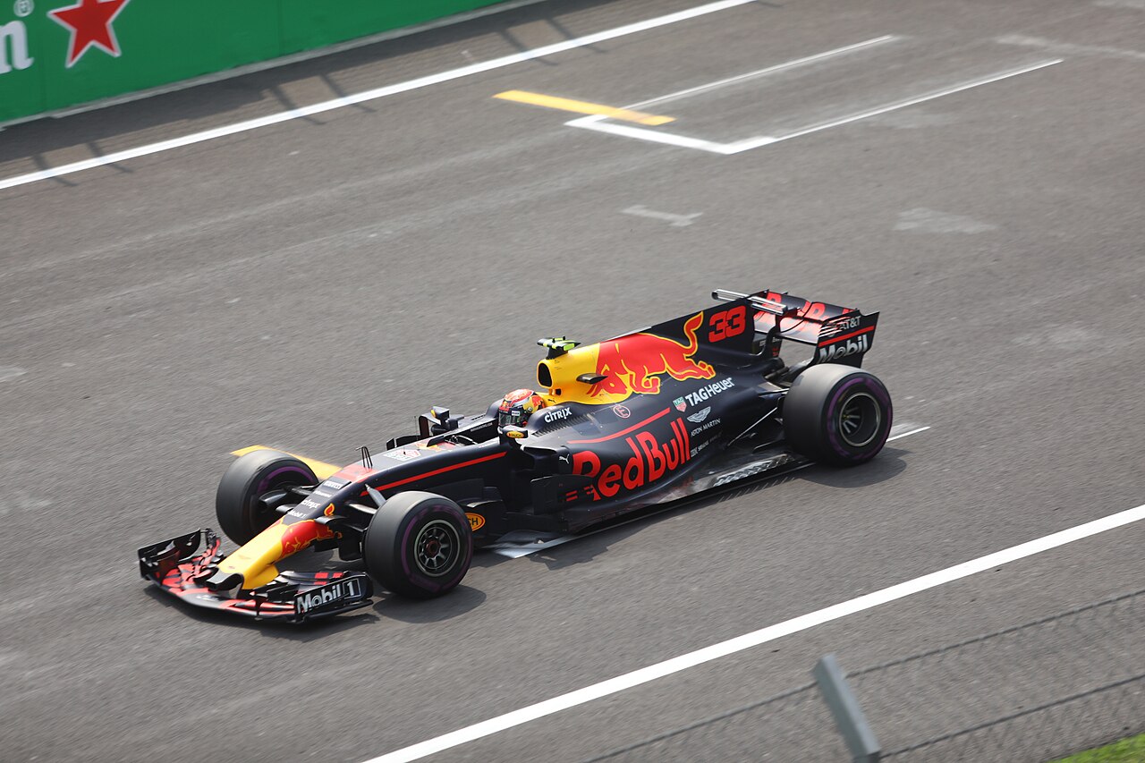 Max Verstappen's dark blue Red Bull, number 33, on the main straight in Mexico City